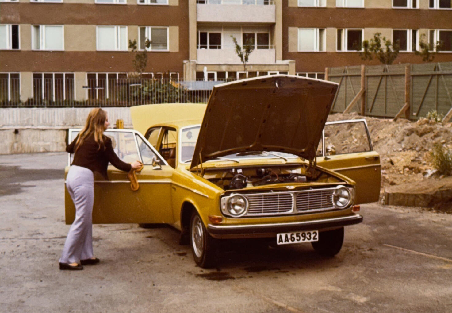 My mother polishing the family’s Volvo 142 - captured in the 1970s.